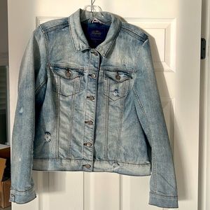 Royalty For Me distressed, light colored jean jacket. Size large.